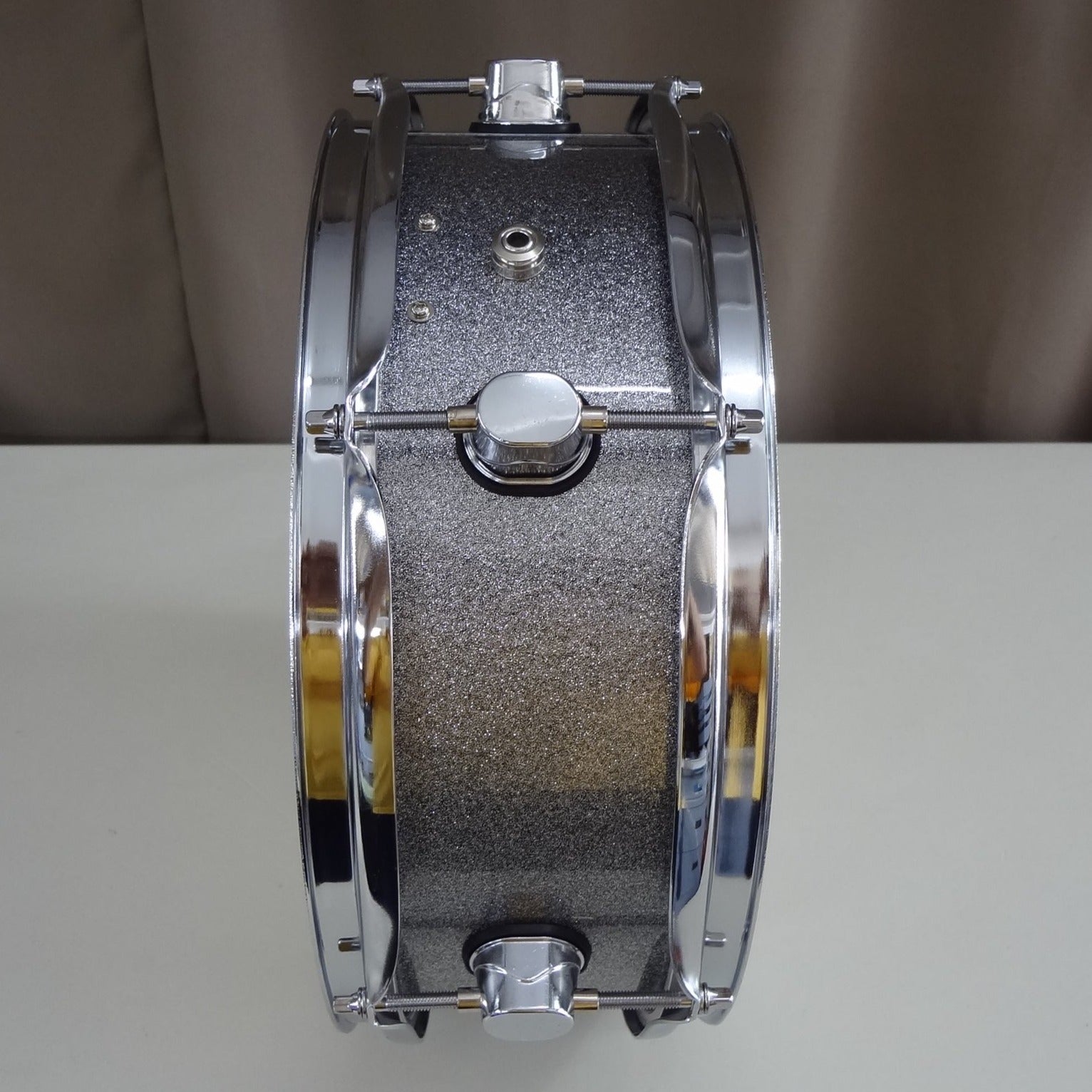 Second edge of new 13 inch custom electronic snare drum silver sparkle wrap